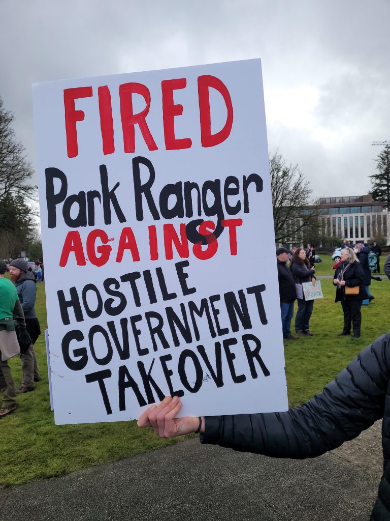A protest sign reading "Fired Park Ranger Against Hostile Government Takeover"